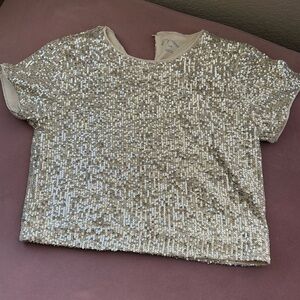Child’s gold sequin top